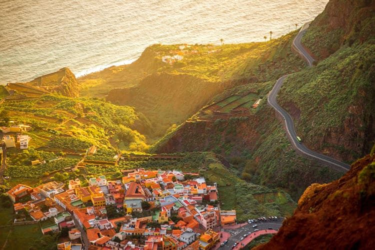 Agulo's whitewashed houses and red-tiled roofs on their volcanic shelf, banana terraces falling away to the Atlantic below